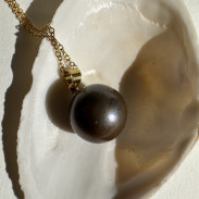 Pendant with natural pearl on a chain